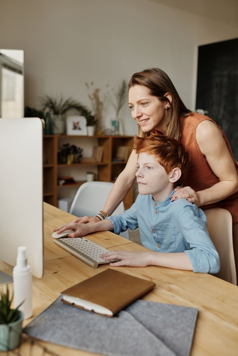 Student learning online with parent support at home