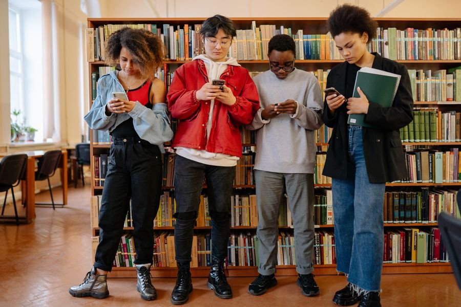 Diverse students studying together in a school library